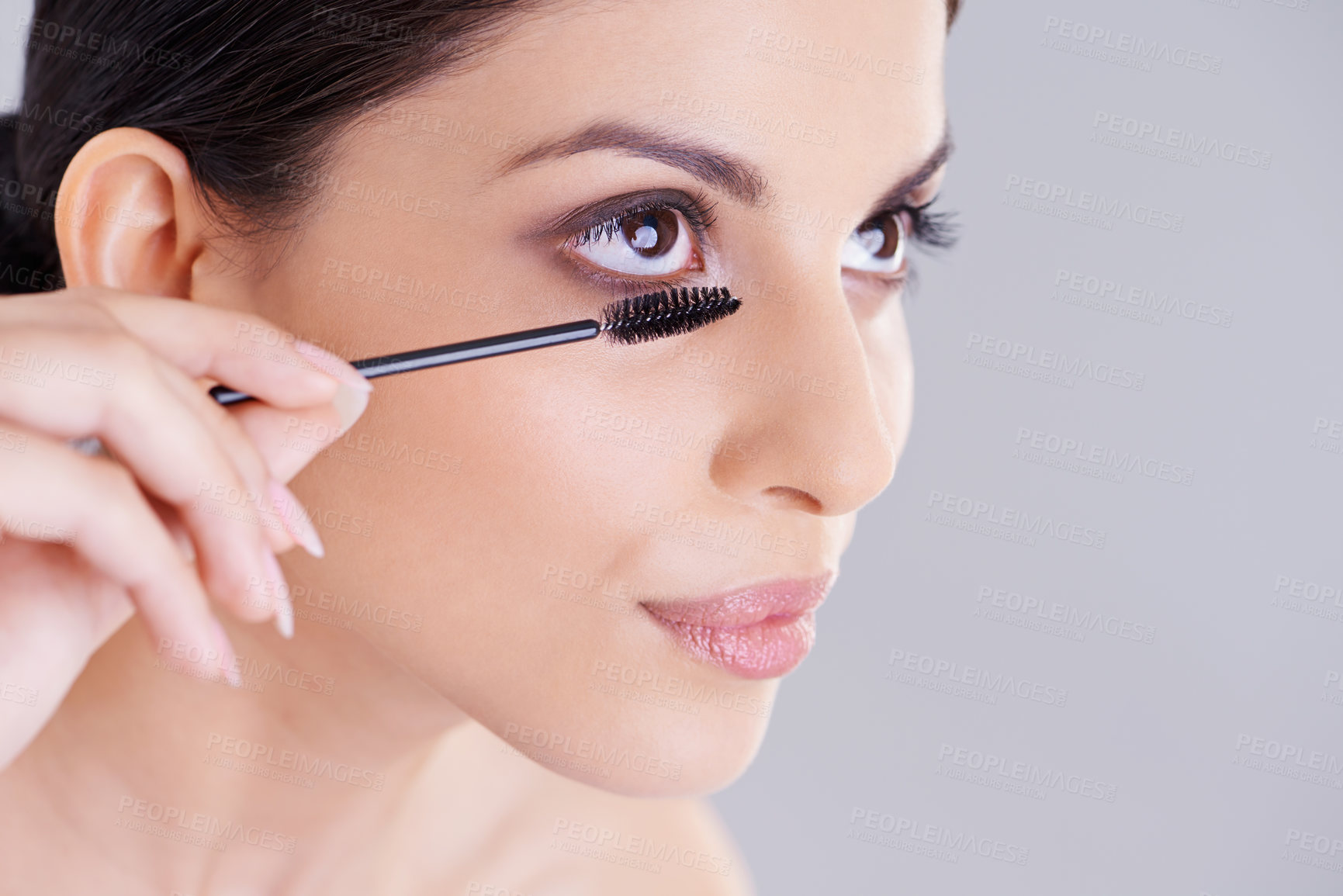Buy stock photo Beauty, mascara and brush for lashes with woman in studio, makeup and cosmetology on white background. Skin, glow and transformation for makeover, cosmetic product and wand for eyelash with volume
