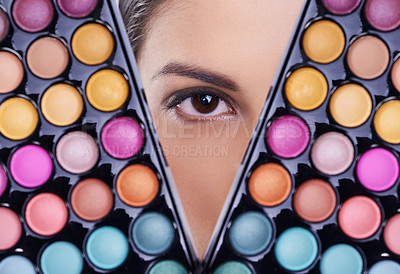 Buy stock photo Beauty, makeup palette and eye of woman in studio for cosmetics, powder and foundation on background. Closeup, skincare and portrait of model with cosmetology product, facial glow and eyeshadow