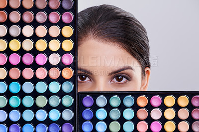 Buy stock photo Beauty, makeup palette and portrait of woman in studio for cosmetics, powder and foundation on gray background. Closeup, skincare and model with cosmetology product, facial glow and eyeshadow