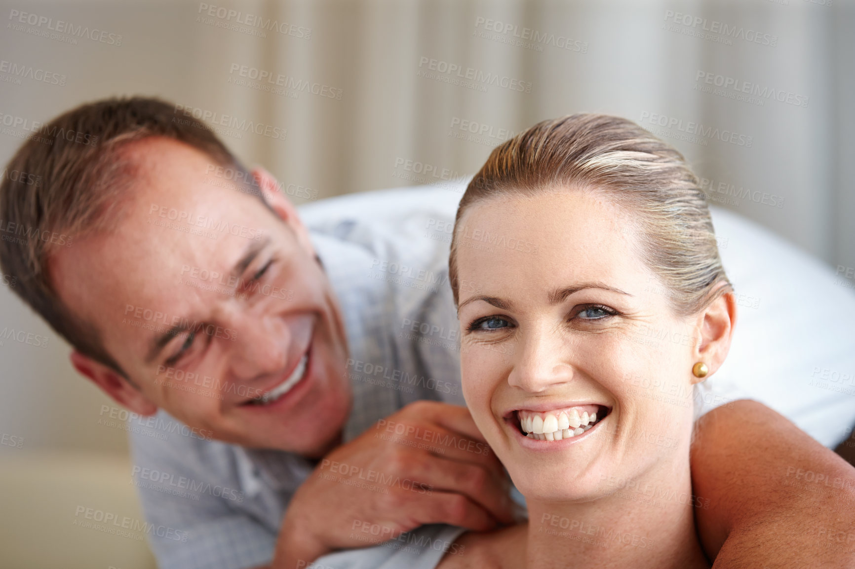 Buy stock photo Love, couple and smile in house in portrait with affection for bonding with hug, relax and partner. Man, woman and happy for embrace with adore in home for peace, trust and connection with confidence