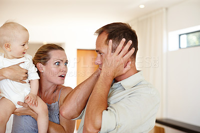 Buy stock photo Couple, child and argument with home, family problem and frustration or anger for domestic life. Father, mother and kid in house, living room and problem with communication for parenting relationship