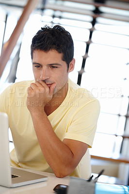 Buy stock photo Man, thinking and  laptop in office for internet, research online and website for company. Young person, editor and sitting with tech for typing, email and creative project for planning and job  