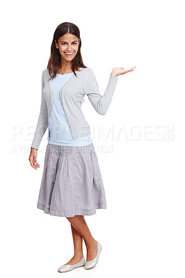 Buy stock photo Happy, casual and woman with product mockup in a studio for placement, marketing or advertising. Fashion, portrait and female model weighing mock up space with her hand isolated by a white background
