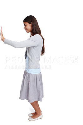 Buy stock photo Push, move and mockup with a woman in studio isolated on a white background moving a poster or billboard. Mock up, effort and pushing with an attractive young female standing alone on blank space