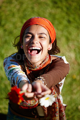 Buy stock photo Shot of a young woman laughing in the outdoors