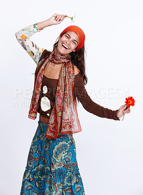 Buy stock photo Woman, fashion and portrait in studio for gypsy and dress for creativity and bohemian style for trend. Lady, model and flowers for excited with skirt for aesthetic and clothes with pattern and colour