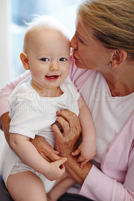 Buy stock photo Happy, baby and grandmother kiss in portrait with love for family, bonding and development. Cute, child and grandma hug at home together with attention, kindness and care while babysitting newborn