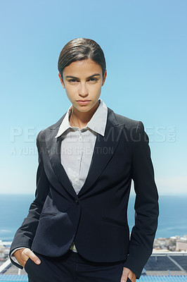 Buy stock photo Businesswoman, portrait and serious outdoors on rooftop, confidence and professional lawyer in city. Female person, blue sky and proud of startup company, entrepreneur and attitude for law firm