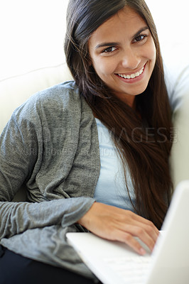 Buy stock photo Laptop, relax and portrait of woman with smile, remote working and career of transcriber in house. Living room, employee and female person with happiness with internet online, comfort and couch