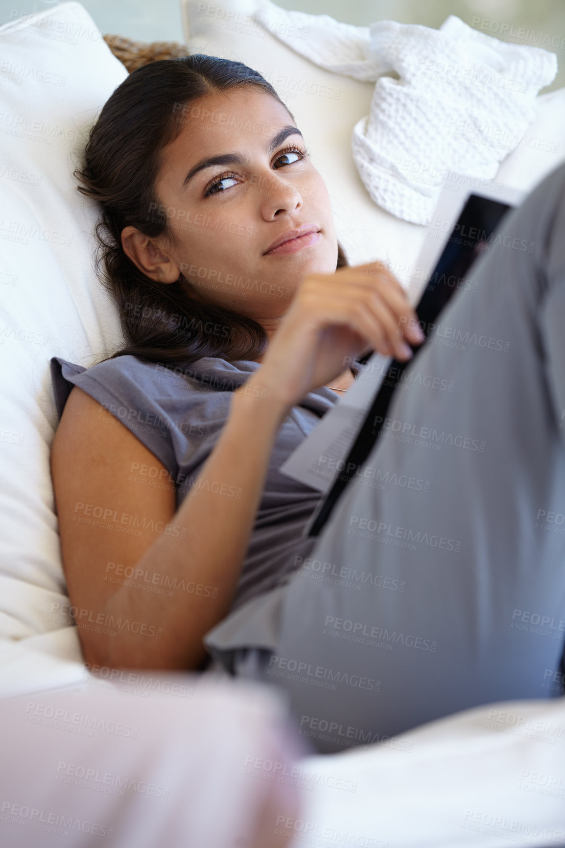 Buy stock photo Woman, sofa and reading magazine in living room for knowledge of media and creative ideas for article writing. Female person, newspaper and relax on couch in house for weekend break in apartment.