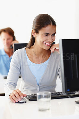 Buy stock photo Computer, smile and business woman reading email, information or coworking in creative startup at desk. Desktop, professional or happy copywriter at table with mouse for good news, feedback or review