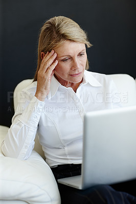 Buy stock photo Mature businesswoman, stress and laptop for thinking, planning and internet for b2b online communication. Female person, CEO and crisis at startup company, finance and accountant for ideas on debt