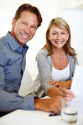 Buy stock photo Man, woman and portrait for business, paperwork and office with workplace, document and smile at work. Businesspeople, happy and working in management, corporate and meeting for review or teamwork
