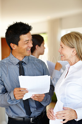 Buy stock photo Paperwork, good news or business people in meeting for report, deal discussion or portfolio for project. Smile, teamwork and workers planning in office talking, conversation or speaking of documents