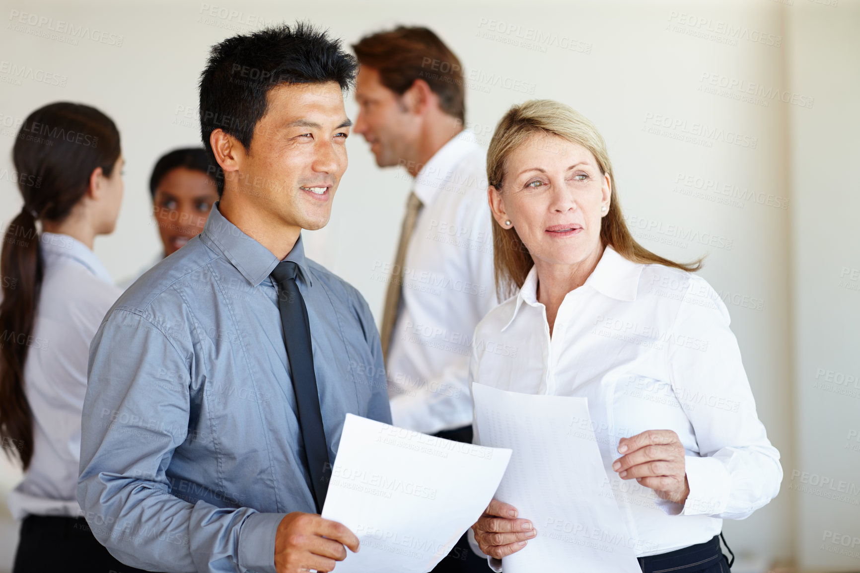 Buy stock photo Documents, thinking or business people in meeting for report, agenda discussion or portfolio for project. Smile, teamwork and workers planning in office talking, conversation or speaking of paperwork