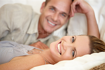 Buy stock photo Couple, smile and portrait in bed together, relax and support or hotel for bonding. Happy people, commitment and romance for date in bedroom, peace and affection for connection in relationship