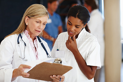 Buy stock photo Doctor, mentor and discussion with charts, results and paperwork for health and wellness. Cardiologist, stethoscope and medical report for healthcare, insurance or professional diagnosis for thinking