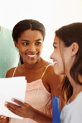 Buy stock photo University, students or women with paperwork for education, college assignment or research project. Diversity, conversation or happy friends with notes or study materials for group work or teamwork