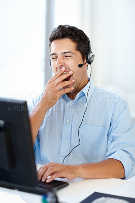 Buy stock photo Tired, yawn or man on laptop in a call center office exhausted in telecom help desk consultation. Sleepy, bored or overworked agent with fatigue, headset or burnout in telemarketing customer service