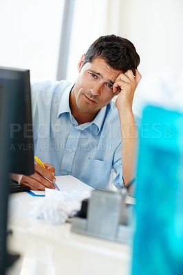 Buy stock photo Office, paper and businessman with stress by monitor for burnout, financial deadline and frustrated at desk. Accountant, documents and pc with headache for anxiety company taxes or expense mistake