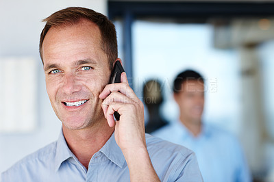 Buy stock photo Portrait, smile and businessman with phone call for business deal, mobile conversation and networking in office. Consultant or man, communication and connect with smartphone or cellphone in workplace