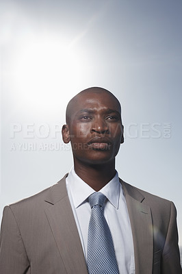 Buy stock photo Business man, outdoor and sky with thinking, vision and ideas for career, growth and development. African corporate lawyer, attorney or employee with suit in summer, sunshine and decision in Atlanta