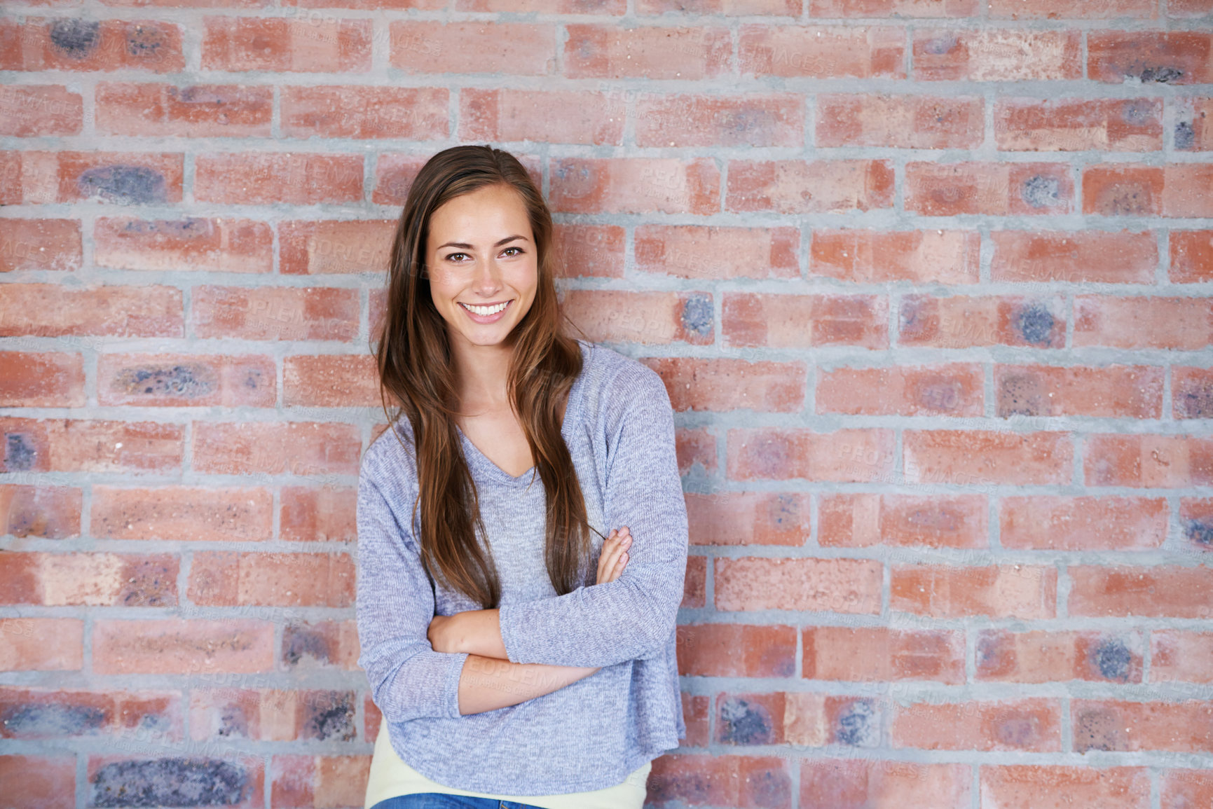 Buy stock photo Portrait, confident or girl in brick wall, design or business as creative, professional or career. Young, female entrepreneur or arms crossed in pride of positive work experience in coworking office