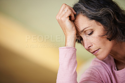 Buy stock photo Closeup of a mature woman with her eyes closed resting her head on her palm