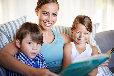 Buy stock photo Mother, children and portrait on sofa with book for reading and learning for english literature or language skills for development. Family, relax and happy on couch in home with love and bonding.