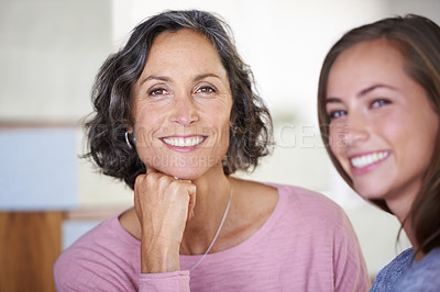 Buy stock photo A mother and daughter smiling happily at the camera