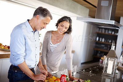 Buy stock photo Love, food and senior couple cooking in kitchen with vegetables for healthy, breakfast or meal at home. Support, retirement and old people in house with salad for diet, balance or meal prep nutrition