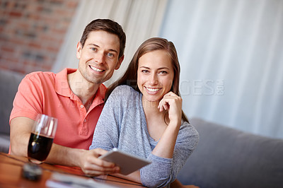 Buy stock photo Couple, portrait and relax in home with tablet for streaming online for movies or films, videos and social media memes. Man, woman and together with hug for bonding or love with affection and support