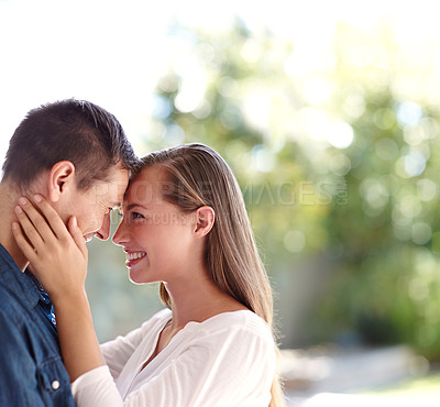 Buy stock photo Touch, couple and forehead in nature for love, marriage and romance or care in outdoors. People, hug and bonding or relax for pride in relationship or commitment, loyalty and connection on date