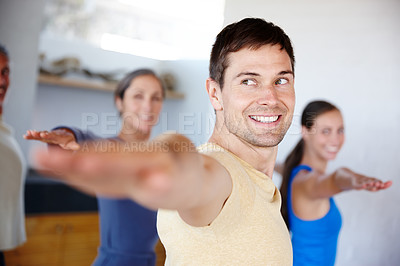 Buy stock photo Diverse, people and yoga with hands for balance, zen and wellness in studio. Smiling women, stretching men and warrior pose for meditation with spiritual, peaceful mindset and training in group class