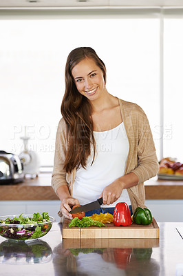 Buy stock photo Woman, kitchen and vegetables for nutrition in portrait, diet and food preparation for cooking. Female person, home and fresh produce for salad or vegan dinner, organic ingredients and cutting green