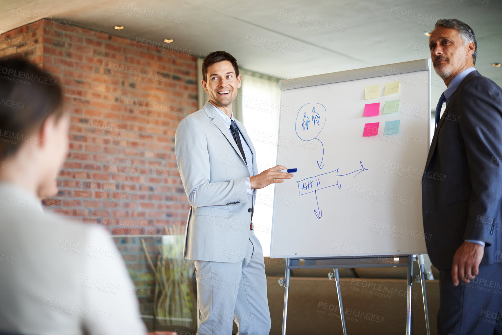Buy stock photo Business presentation, men or speaker by a board for teaching, advice tips or skill development in meeting. Project, workshop or boss talking in mentorship, training or coaching a team for learning 