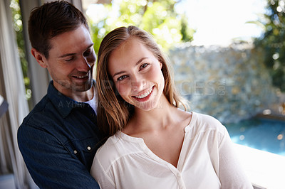Buy stock photo Home, couple and portrait in embrace for love, marriage and romance or care in living room. Happy people, hugging and smile for pride in relationship or commitment, loyalty and connection on date