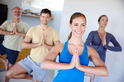 Buy stock photo A cropped shot of a happy family doing yoga together