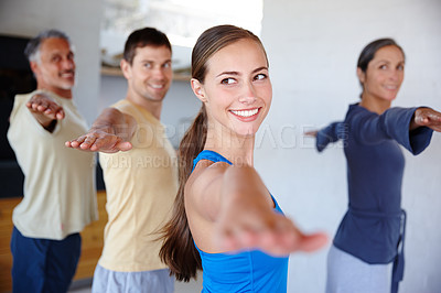 Buy stock photo People, yoga and class with smile, fitness and wellness for mindfulness, wellbeing and health. Men, women and session at gym, studio and together for physical, activity and training in Virabhadrasana