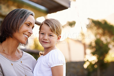 Buy stock photo Grandmother, outdoor and granddaughter with love, sunshine and bonding together with weekend break. Family, outside and old woman with girl and elderly person with kid and child with fun and joyful