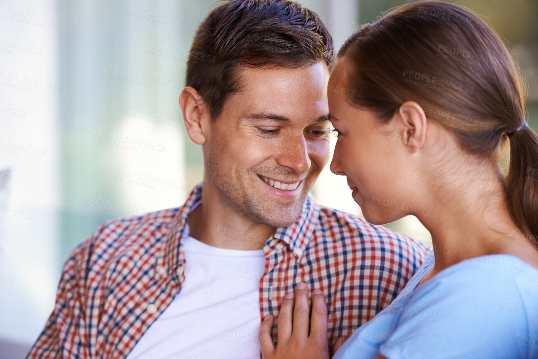 Buy stock photo Shot of an affectionate couple sitting together