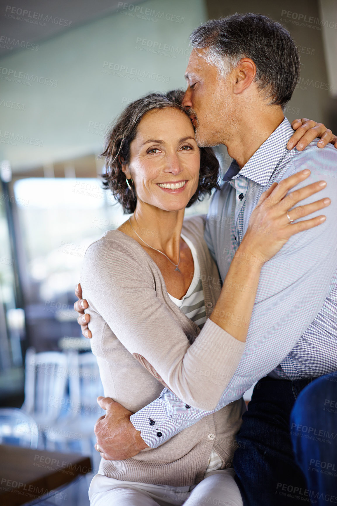 Buy stock photo Portrait, smile and couple with hug, embrace and relationship with love or happiness at home. Face, man and happy woman with kiss on forehead, affection and bonding with marriage or romantic