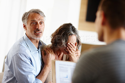 Buy stock photo Mature couple, bad news or stress in home with surprise, crying or sad in meeting with financial advisor. Senior, man and woman with announcement for pension fund fail, bankruptcy and investment debt