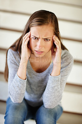 Buy stock photo Portrait, headache and woman in house with stress, frustrated or mental health, crisis or disaster. Stairs, doubt or angry female person face with broken heart overwhelmed by anxiety, fail or mistake