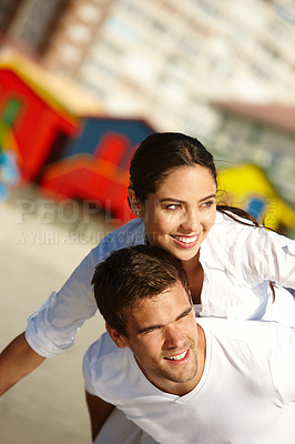 Buy stock photo Happy couple, beach and piggyback with love for valentines day, embrace or summer holiday together in outdoor fun. Man and woman on back ride with smile by ocean coast in nature, bonding or support