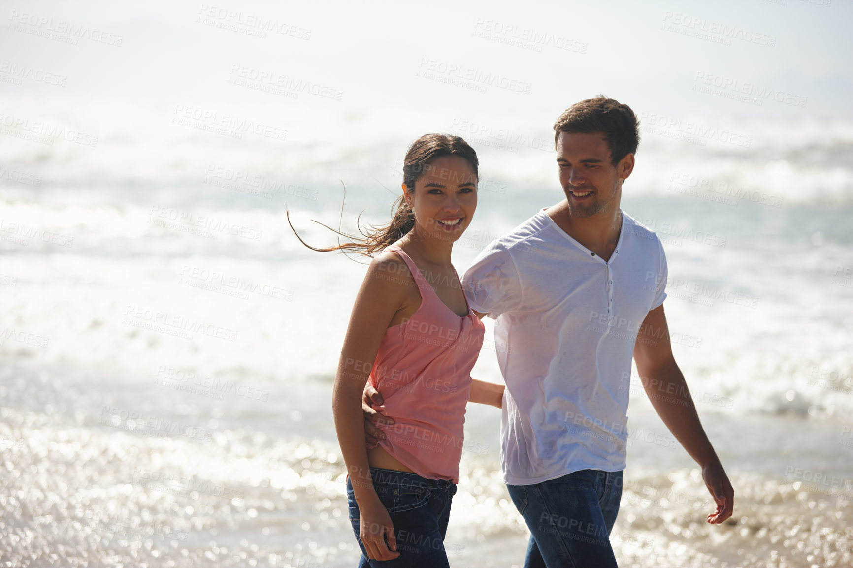 Buy stock photo Hug, love and couple at a beach walking, calm and bonding on ocean adventure together. Travel, sunset and people at sea embrace with care, support and trust for summer, holiday or journey in nature