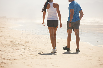 Buy stock photo Couple, fitness and walking on beach with partner for workout, exercise or training together in nature. Rear view of active man and woman in stroll, cardio or health and wellness on the ocean coast