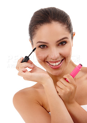 Buy stock photo Portrait of an attractive young woman applying mascara to her eyelashes