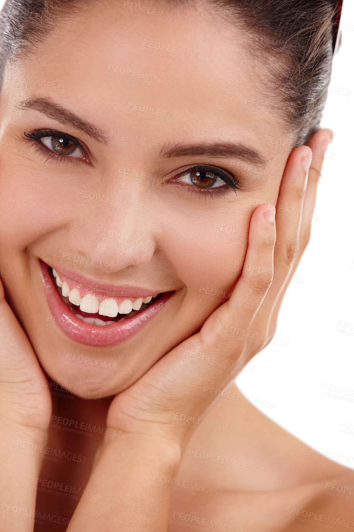 Buy stock photo Cropped shot of a beautiful woman standing in a studio with her hands on her face