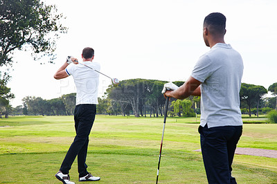 Buy stock photo Man, golfer and friends playing with club for sports, game or outdoor match in competition on green grass. Male person or people hitting ball on golf course for fun exercise or practice on field